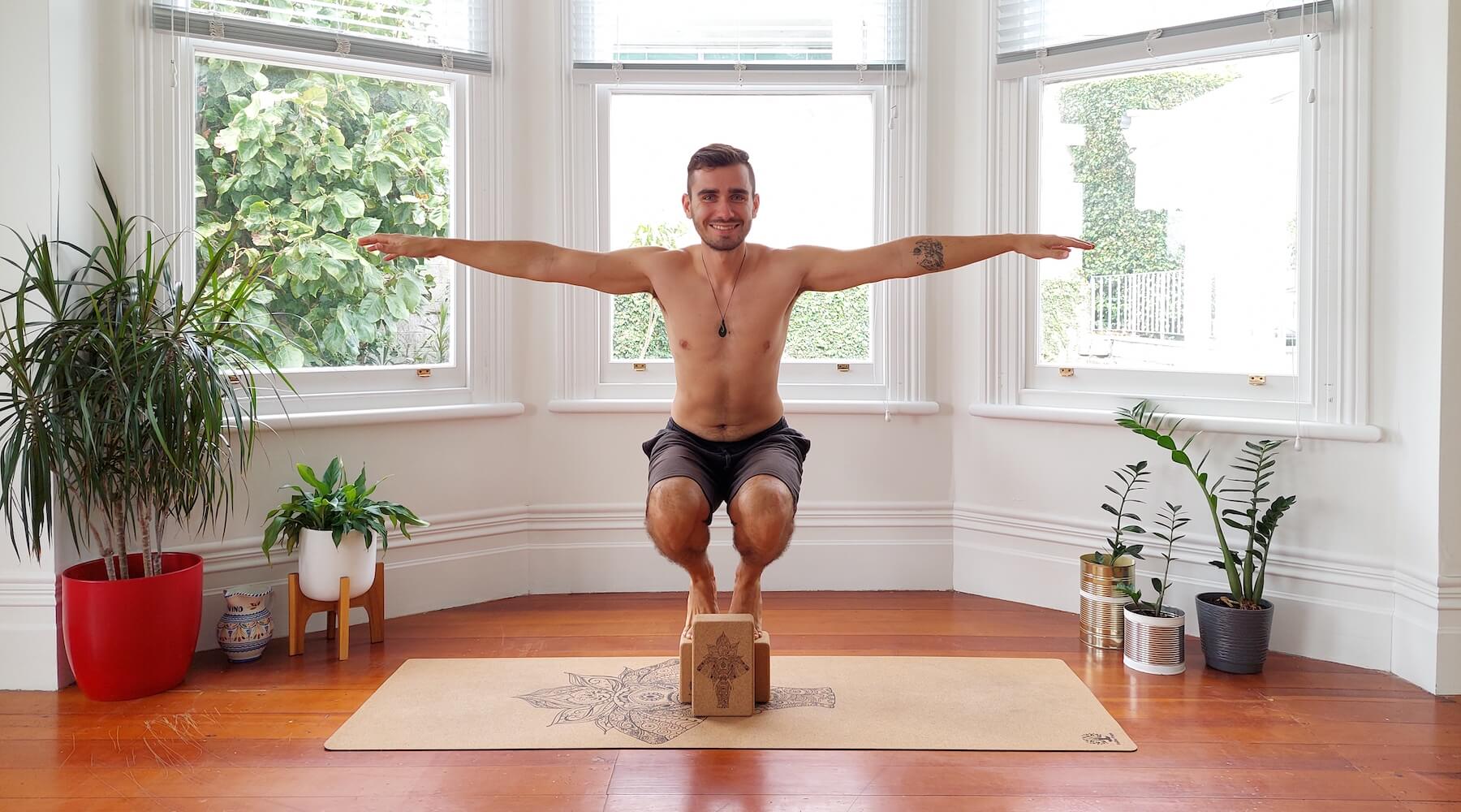 Yogi balancing on yoga blocks