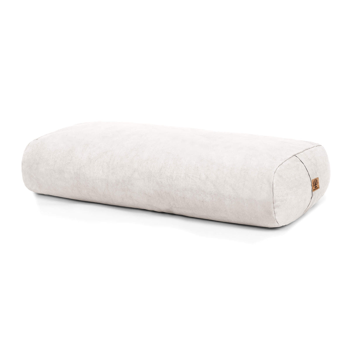A rectangular bolster in an off white linen-like fabric, shown on a clean white background with a small cork tag on one end