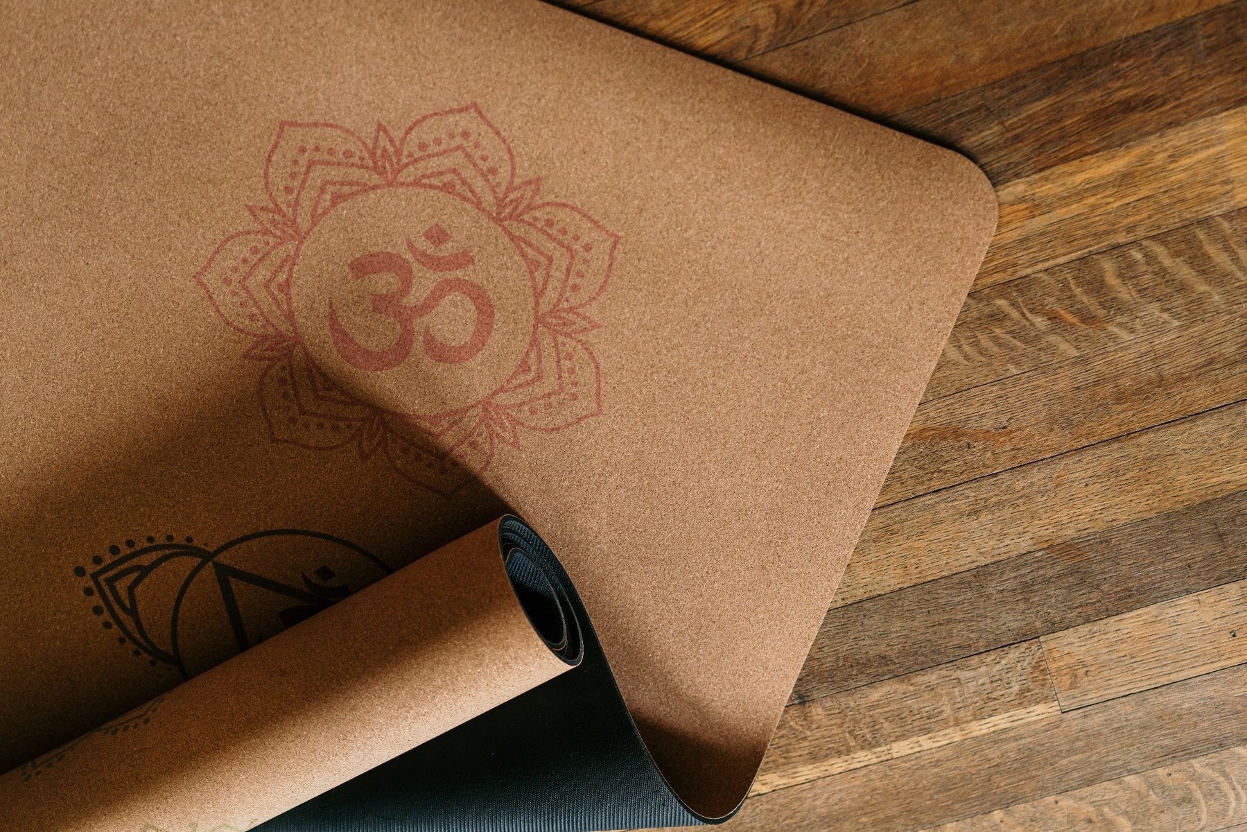 Rolled up cork yoga mat with Chakra design